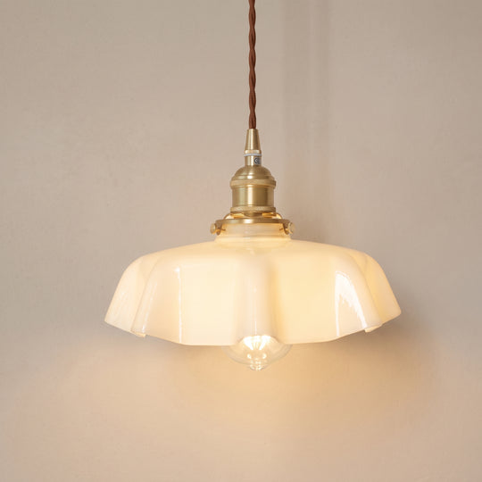 Vintage opaline glass pendant light, cream ruffled shade, studio shot on a neutral backdrop