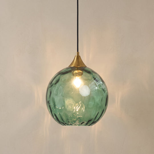 Modern glass ball pendant light, studio shot on a neutral backdrop
