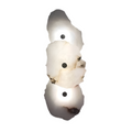 Irregular marble wall sconce, three-slab cut-out on white