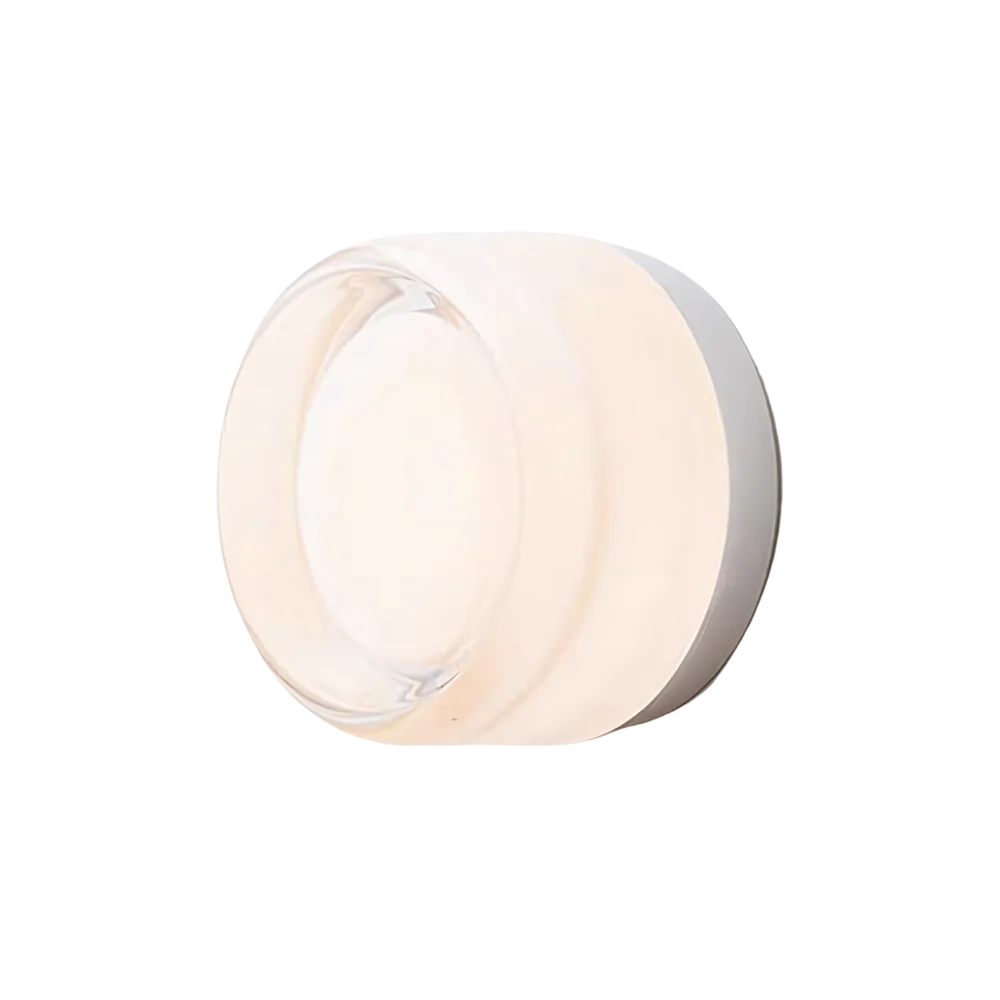 Dusk-to-dawn glass wall sconce, white dimple version on a pale backdrop