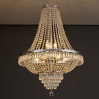European crystal chandelier, lit close view of the silver band and beaded strands