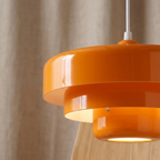 Retro Norwegian Acrylic Pendant Light lifestyle image - Higgsfield lux20v1 - a3