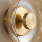 The Shimmering Glow Premium Minimalist Brass Wall Light lifestyle image - Higgsfield lux20v1 - a3