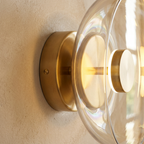 The Shimmering Glow Premium Minimalist Brass Wall Light lifestyle image - Higgsfield lux20v1 - a4