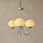 Marshmallow Modern Glass Chandelier lifestyle image - Higgsfield lux20v1 - a2
