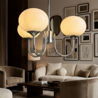 Marshmallow Modern Glass Chandelier lifestyle image - Higgsfield lux20v1 - a6