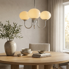 Marshmallow Modern Glass Chandelier lifestyle image - Higgsfield lux20v1 - a19