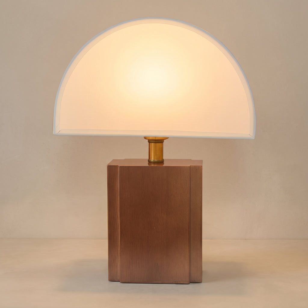 Wabi sabi half moon table lamp, white shade on a wood block base, studio shot on a neutral backdrop