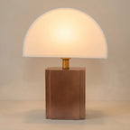Wabi sabi half moon table lamp, white shade on a wood block base, studio shot on a neutral backdrop