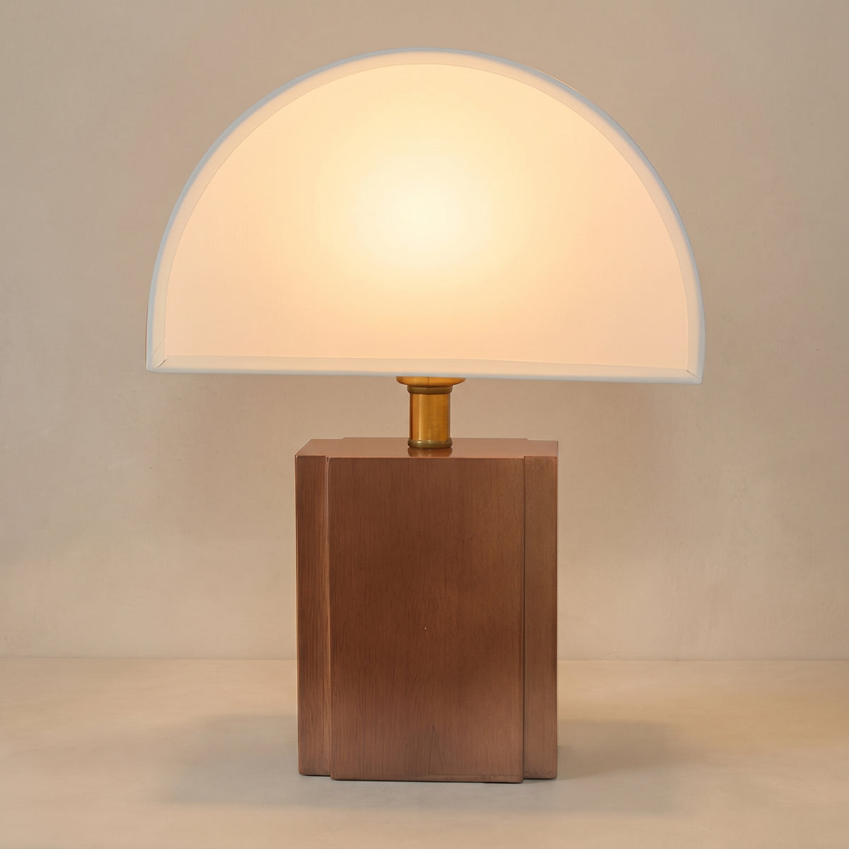 Wabi sabi half moon table lamp, white shade on a wood block base, studio shot on a neutral backdrop