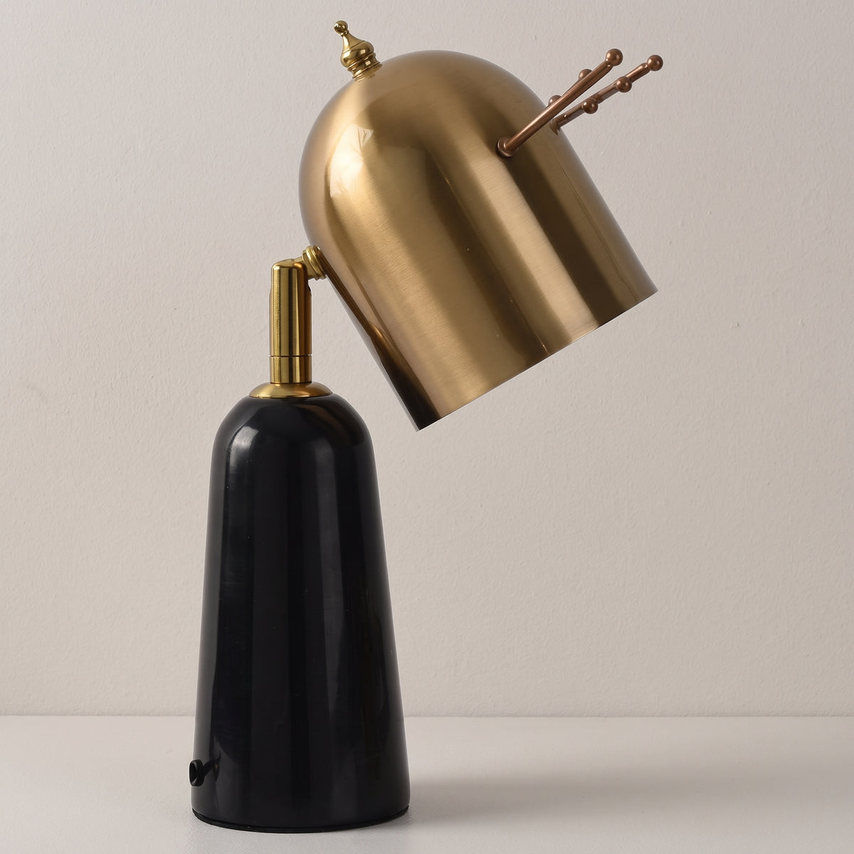 Antler marble table lamp, brass dome head on black base, studio shot on a neutral backdrop