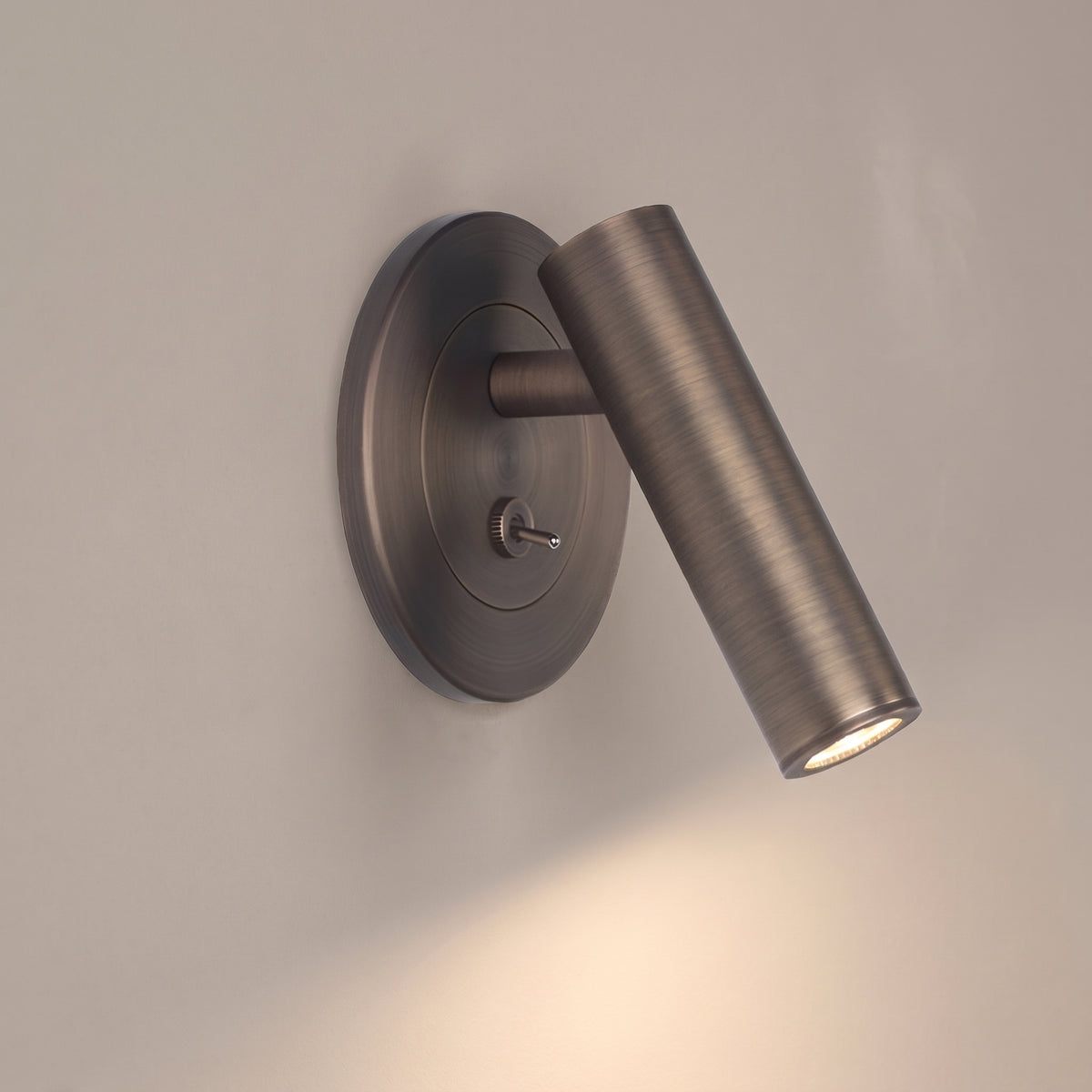 Scottie minimalist wall sconce, studio shot on a neutral backdrop