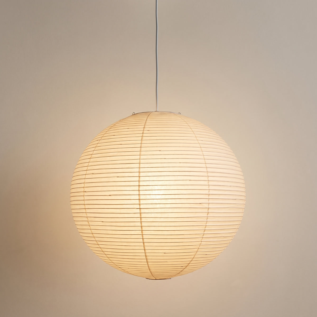 Sky Burst paper pendant light, white globe lantern, studio shot on a neutral backdrop
