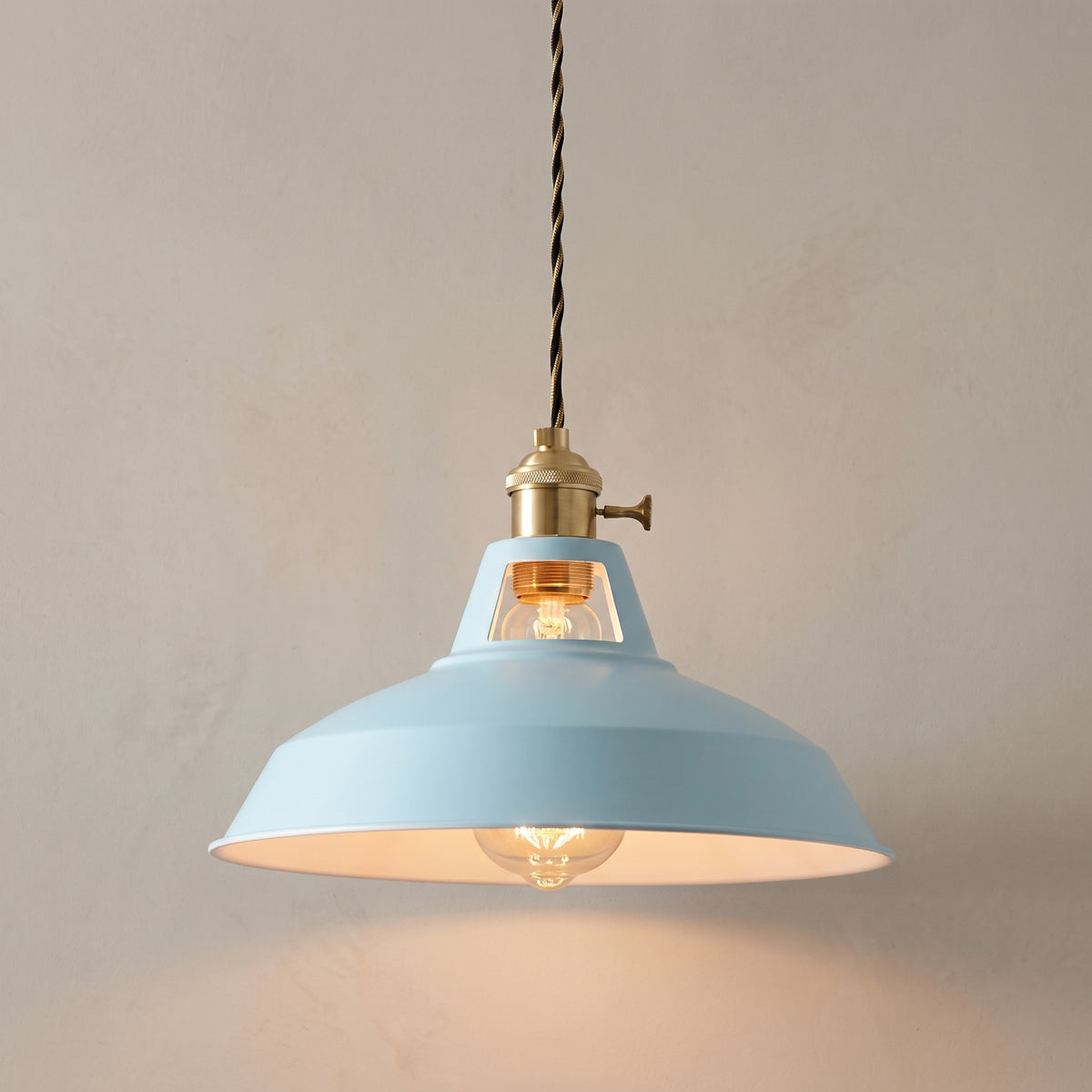 Timeless Classic barn pendant light in sky blue with twisted cord, studio shot on a neutral backdrop
