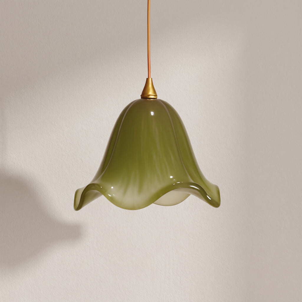 Verdantia green glass flower pendant light, olive bell shade with ruffled rim, studio shot on a neutral backdrop